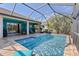 Refreshing screened pool with patio furniture at 10788 Trophy Dr, Englewood, FL 34223