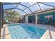 Inviting screened pool area with patio furniture at 10788 Trophy Dr, Englewood, FL 34223