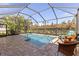 Relaxing screened pool and patio furniture at 10788 Trophy Dr, Englewood, FL 34223