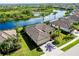 Single-Gathering home with tile roof and lush landscaping near water at 20314 Passagio Dr, Venice, FL 34293