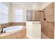 Large bathroom with a luxurious soaking tub and shower at 20314 Passagio Dr, Venice, FL 34293