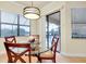 Breakfast nook with glass table and chairs, offering pool and garden views at 20314 Passagio Dr, Venice, FL 34293