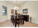 Formal dining room with a chandelier and six chairs at 20314 Passagio Dr, Venice, FL 34293