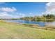 Scenic view of a tranquil lake with lush greenery at 20314 Passagio Dr, Venice, FL 34293