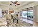 Relaxing living room with view of pool and conservation area at 20314 Passagio Dr, Venice, FL 34293