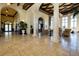 Spacious lobby with high ceilings and classic columns at 20314 Passagio Dr, Venice, FL 34293