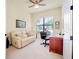 Bright office with large window, comfortable seating and a desk at 20314 Passagio Dr, Venice, FL 34293