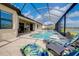 Private screened-in pool and spa with comfortable lounge chairs at 20314 Passagio Dr, Venice, FL 34293