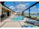 Luxury pool and spa with screened enclosure and relaxing lounge chairs at 20314 Passagio Dr, Venice, FL 34293