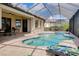 Enjoy this large pool and spa with covered lanai and tranquil lake view at 20314 Passagio Dr, Venice, FL 34293