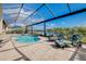 Spacious pool and spa with covered patio and stunning lake views at 20314 Passagio Dr, Venice, FL 34293