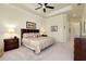 Spacious Primary bedroom with king-size bed and en-suite bathroom at 20314 Passagio Dr, Venice, FL 34293