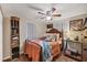 Cozy bedroom featuring a wooden bed frame and a ceiling fan at 2191 Park Rd, Venice, FL 34293