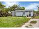 Quaint single-story home with a well-maintained lawn at 2191 Park Rd, Venice, FL 34293