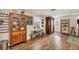 Living room with hardwood floors, antique furniture, and decor at 2191 Park Rd, Venice, FL 34293