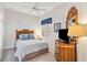 Guest bedroom with wooden dresser, double bed, and ceiling fan at 2232 Lynx Run, North Port, FL 34286