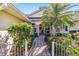 Inviting front entry with brick pavers, lush landscaping, and a charming walkway at 2232 Lynx Run, North Port, FL 34286