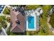 Aerial view of community pool and building. Enjoy resort-style living! at 2232 Lynx Run, North Port, FL 34286