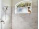 Clean shower with updated fixtures and a window at 2232 Lynx Run, North Port, FL 34286