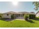 Spacious backyard with screened patio and lush lawn at 338 Woodvale Dr, Venice, FL 34293