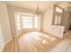 Bright dining area with bay window and wood-look flooring at 338 Woodvale Dr, Venice, FL 34293