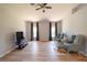 Living room featuring two armchairs and a flat-screen TV at 338 Woodvale Dr, Venice, FL 34293