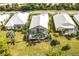 Aerial view of house with screened pool and patio at 340 Bermuda Ct # 5, Venice, FL 34293