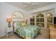 Bedroom with floral bedding and bay window at 340 Bermuda Ct # 5, Venice, FL 34293