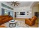 Relaxing living room featuring leather sofas and a large-screen TV at 340 Bermuda Ct # 5, Venice, FL 34293