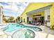 Large pool with spa, outdoor kitchen and dining area at 340 Bermuda Ct # 5, Venice, FL 34293