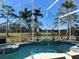 Relaxing pool and spa with a screened enclosure at 340 Bermuda Ct # 5, Venice, FL 34293