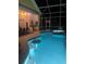 Lighted pool and spa at night with swim-up bar at 340 Bermuda Ct # 5, Venice, FL 34293