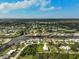 Aerial view of a single story house on a waterfront lot with lush landscaping at 4130 Rock Creek Dr, Port Charlotte, FL 33948