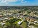 Aerial view of a single story house on a waterfront lot with lush landscaping at 4130 Rock Creek Dr, Port Charlotte, FL 33948