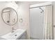 Bright bathroom featuring a vanity, shower, and a large mirror at 4130 Rock Creek Dr, Port Charlotte, FL 33948