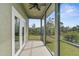 Enjoy the view from this screened porch, complete with ceiling fan at 4130 Rock Creek Dr, Port Charlotte, FL 33948