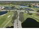 Aerial view of golf course community clubhouse at 444 Pinewood Lake Dr, Venice, FL 34285