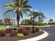 Landscaped entrance to the community clubhouse at 444 Pinewood Lake Dr, Venice, FL 34285