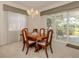 Formal dining room with table and chairs, access to patio at 444 Pinewood Lake Dr, Venice, FL 34285