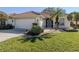 One-story house featuring a tile roof and well-maintained lawn at 444 Pinewood Lake Dr, Venice, FL 34285