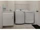 Laundry room with washer, dryer, and utility sink at 444 Pinewood Lake Dr, Venice, FL 34285