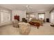 Open concept living room, kitchen, and dining area at 444 Pinewood Lake Dr, Venice, FL 34285