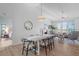 Bright dining room with a view of the pool and living areas at 5003 Southern Pine Cir, Venice, FL 34293