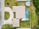 Bird's eye view of house, pool, shed, and circular driveway at 5172 Rolla Rd, Venice, FL 34293