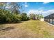 Large backyard with lush landscaping and plenty of space for recreation at 5172 Rolla Rd, Venice, FL 34293