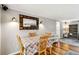 Small dining area with table and chairs and decorative mirror at 5172 Rolla Rd, Venice, FL 34293