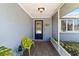 Screened porch with a bright yellow bench and tiled floor at 5172 Rolla Rd, Venice, FL 34293