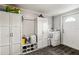 Functional laundry room with ample cabinet space at 5172 Rolla Rd, Venice, FL 34293