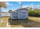 Large storage shed with double doors, ideal for storing yard equipment at 5172 Rolla Rd, Venice, FL 34293