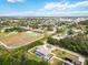 Neighborhood view showcasing homes, park, and community landscape at 5296 Rolla Rd, Venice, FL 34293